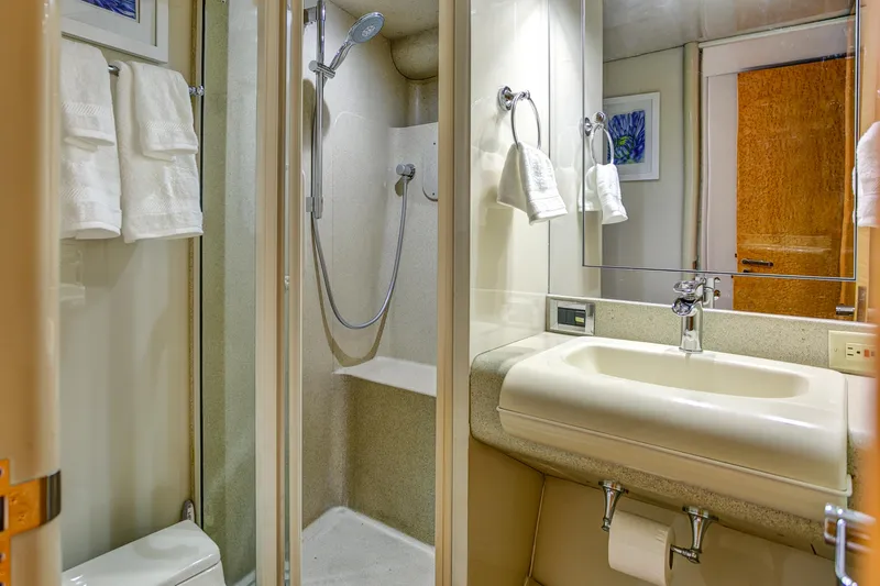 Mautica Yacht Photos Pics Luxurious bathroom in 1994 Lazzara 76 yacht with shower and sink.