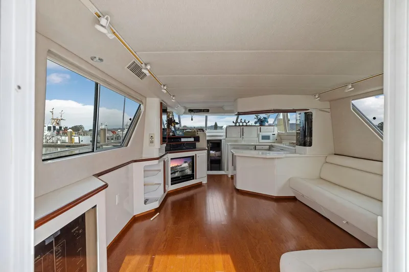  Yacht Photos Pics Interior of 1994 Sea Ray 550 Sedan Bridge yacht with modern furnishings and panoramic windows.