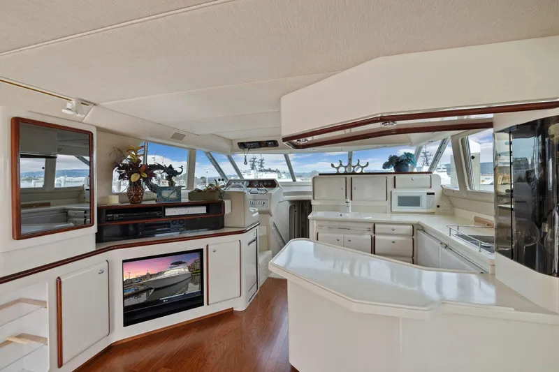  Yacht Photos Pics Luxurious interior of 1994 Sea Ray 550 Sedan Bridge yacht with modern amenities and elegant design.