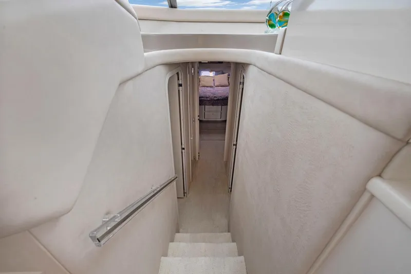 Yacht Photos Pics Stairway inside 1994 Sea Ray 550 Sedan Bridge yacht, leading to cozy cabin.