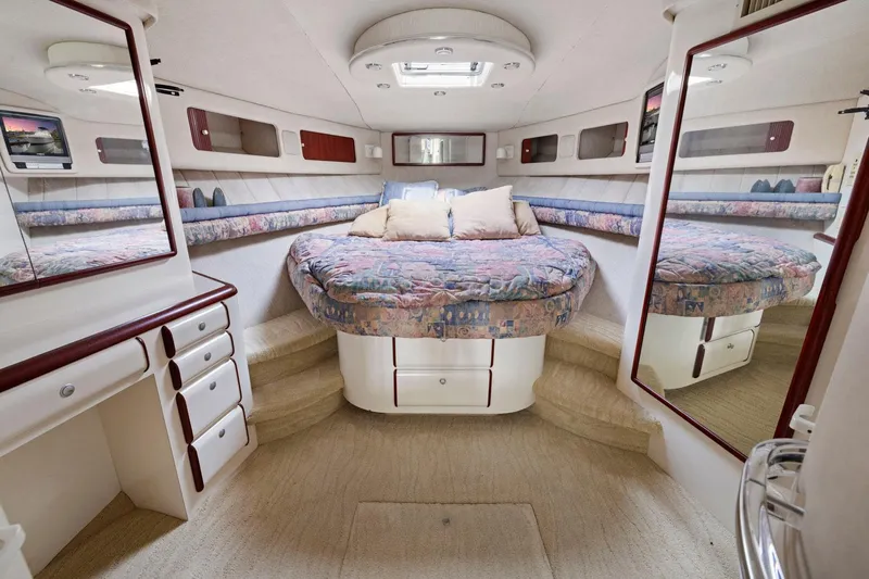  Yacht Photos Pics Luxurious 1994 Sea Ray 550 Sedan Bridge cabin with cozy bed and elegant decor.