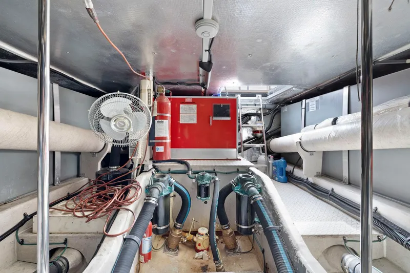  Yacht Photos Pics Engine room of 1994 Sea Ray 550 Sedan Bridge with equipment and piping.