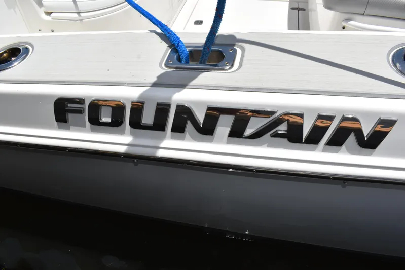 Harry's Dream Yacht Photos Pics 2005 Fountain 38 Sportfish CC Tournament boat with logo and blue rope detail.