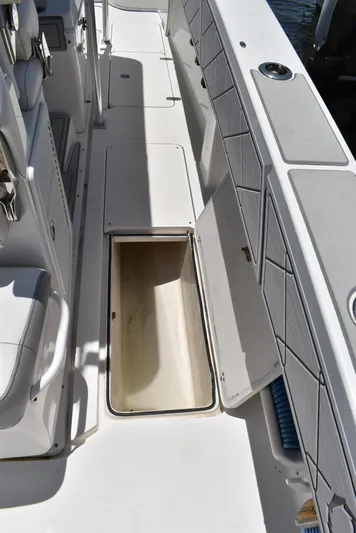 Harry's Dream Yacht Photos Pics 2005 Fountain 38 Sportfish CC Tournament boat deck with open storage compartment.
