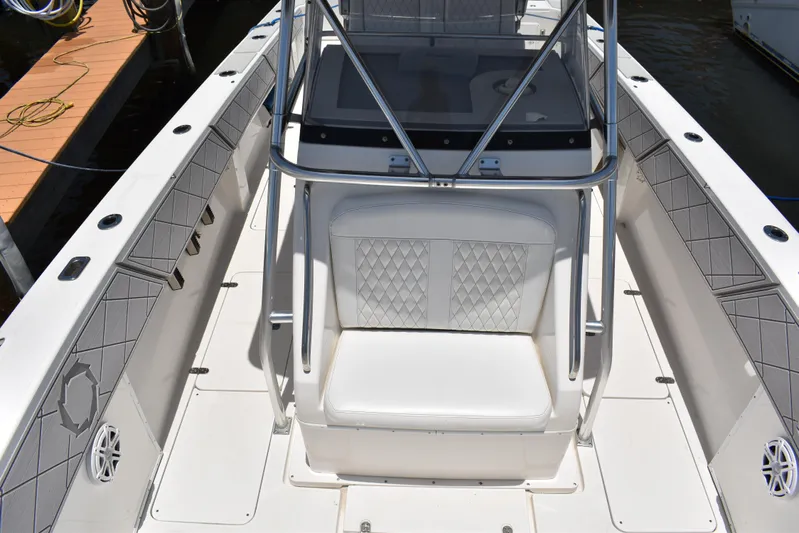 Harry's Dream Yacht Photos Pics 2005 Fountain 38 Sportfish CC Tournament boat interior with white seating and diamond-patterned upholstery.