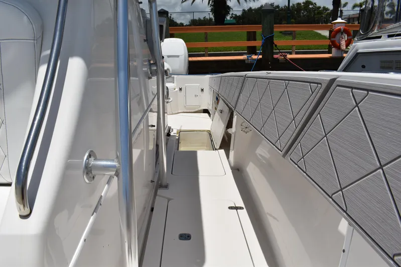 Harry's Dream Yacht Photos Pics 2005 Fountain 38 Sportfish CC Tournament boat deck with sleek design and railing.