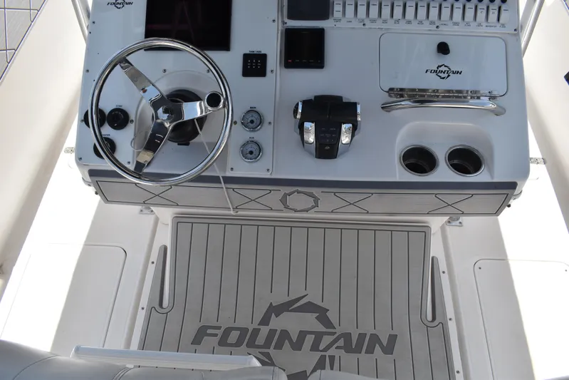 Harry's Dream Yacht Photos Pics 2005 Fountain 38 Sportfish CC Tournament boat dashboard with steering wheel and controls.