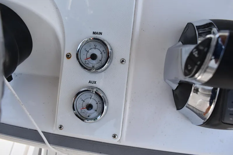 Harry's Dream Yacht Photos Pics Fuel gauges on a 2005 Fountain 38 Sportfish CC Tournament boat dashboard.