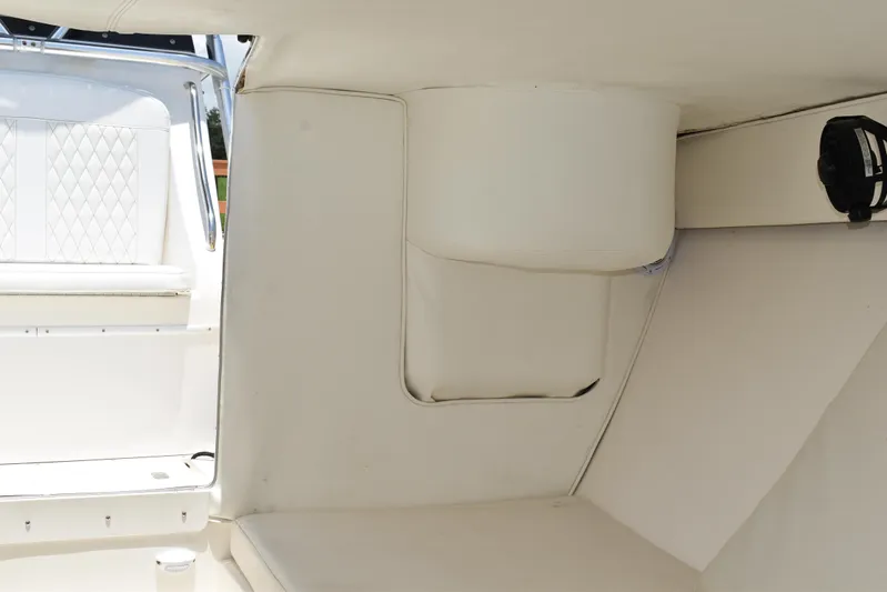 Harry's Dream Yacht Photos Pics Interior of 2005 Fountain 38 Sportfish CC Tournament boat with white seating and speaker.