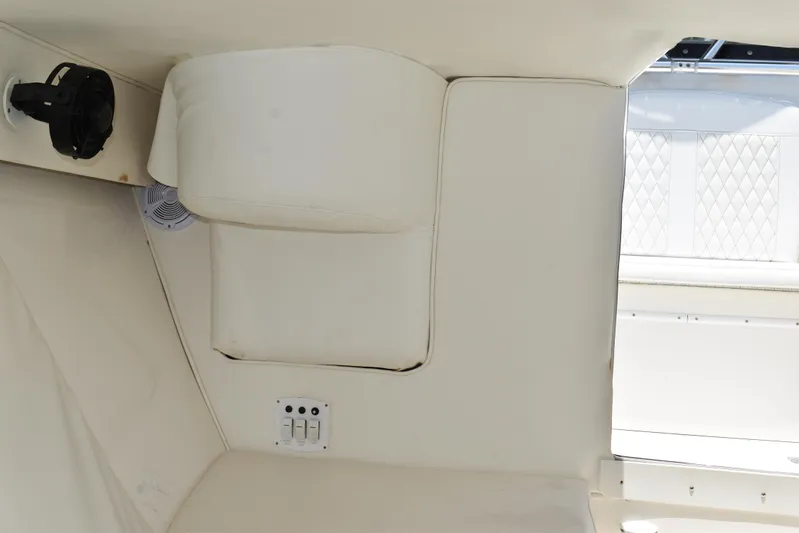 Harry's Dream Yacht Photos Pics Interior view of a 2005 Fountain 38 Sportfish CC Tournament boat, featuring white seating.