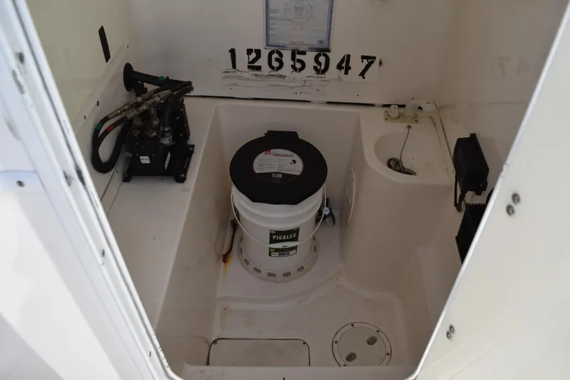 Harry's Dream Yacht Photos Pics 2005 Fountain 38 Sportfish CC Tournament interior with equipment and storage bucket.