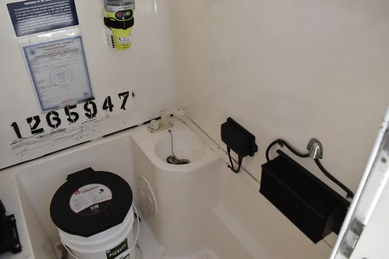 Harry's Dream Yacht Photos Pics Interior of 2005 Fountain 38 Sportfish CC Tournament boat with equipment and documentation.