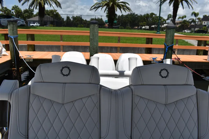 Harry's Dream Yacht Photos Pics Luxury seating on a 2005 Fountain 38 Sportfish CC Tournament boat at a dock.