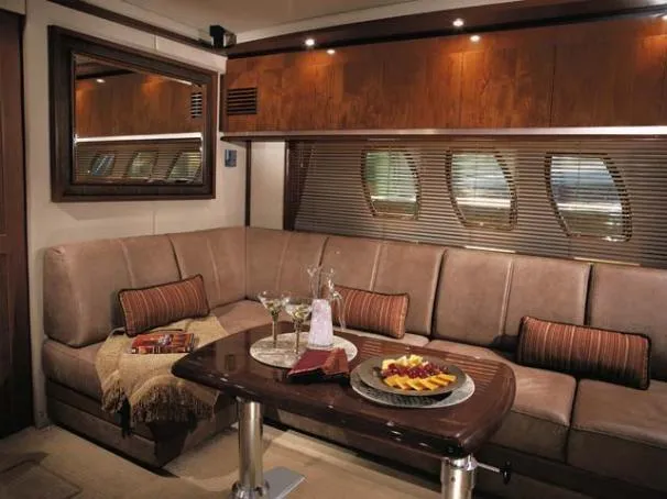 United Yacht Photos Pics Luxurious interior of 2007 Sea Ray 480 Sundancer yacht with plush seating and dining table.
