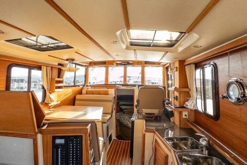 R & R Yacht Photos Pics Interior of 2019 Ranger Tugs R-31-S boat with wood finish and modern amenities.