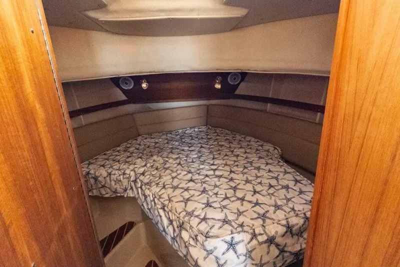 R & R Yacht Photos Pics 2019 Ranger Tugs R-31-S cabin interior with starfish-patterned bedding.