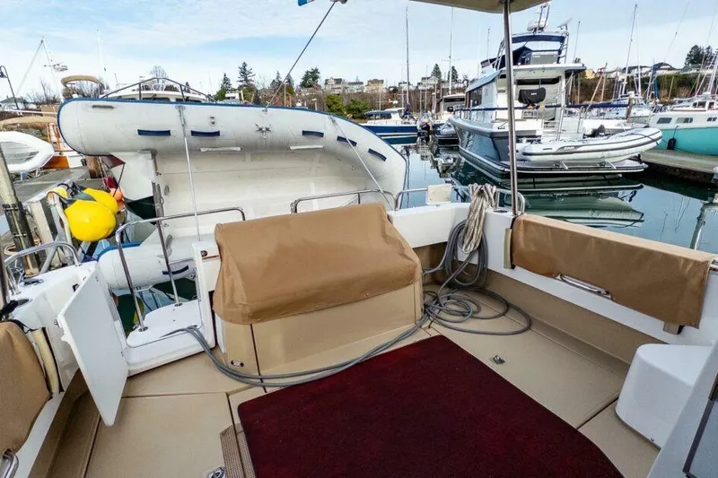 R & R Yacht Photos Pics 2019 Ranger Tugs R-31-S boat interior with docked inflatable dinghy and marina view.