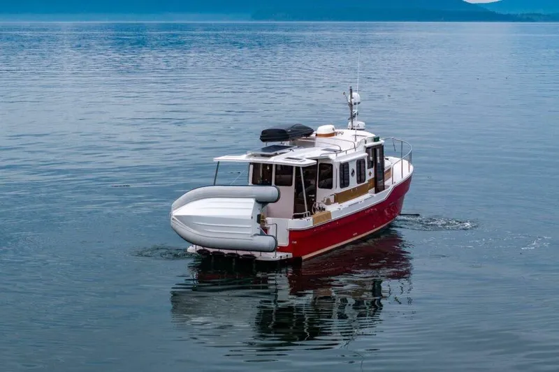R & R Yacht Photos Pics 2019 Ranger Tugs R-31-S boat cruising on calm water.