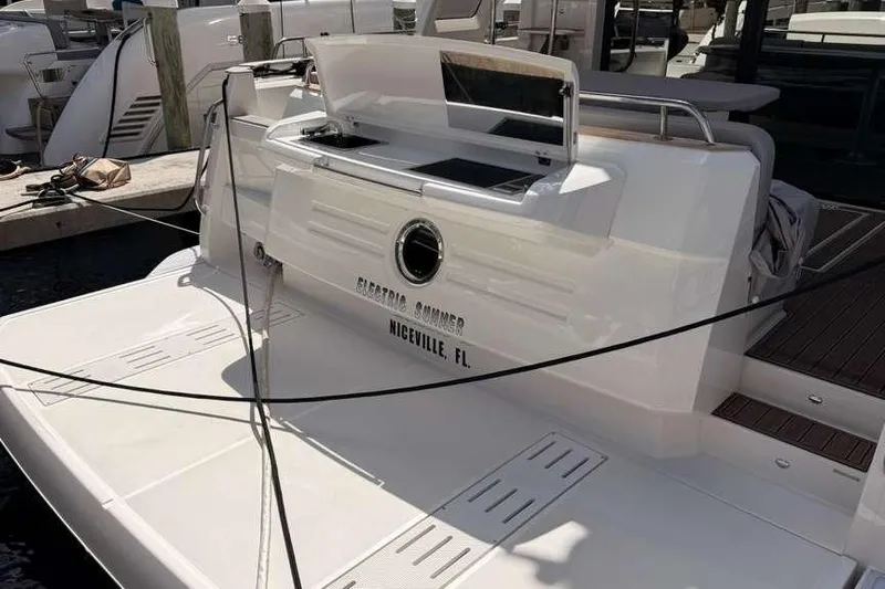 Electric Summer Yacht Photos Pics 2024 Greenline 48 Fly Hybrid yacht docked, featuring sleek design and modern amenities.