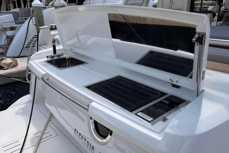 Electric Summer Yacht Photos Pics 2024 Greenline 48 Fly Hybrid yacht with outdoor kitchen and grill setup.