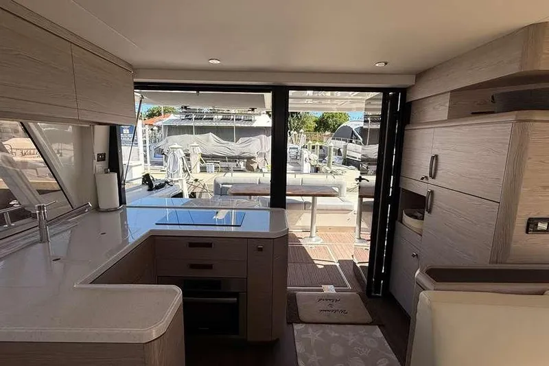 Electric Summer Yacht Photos Pics Interior of 2024 Greenline 48 Fly Hybrid yacht, featuring modern kitchen and outdoor view.
