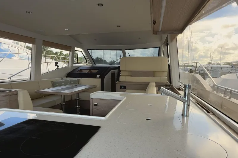Electric Summer Yacht Photos Pics Interior of 2024 Greenline 48 Fly Hybrid yacht, featuring modern kitchen and seating area.