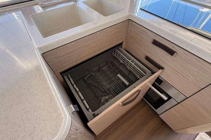 Electric Summer Yacht Photos Pics Modern kitchen with open dishwasher on 2024 Greenline 48 Fly Hybrid yacht.