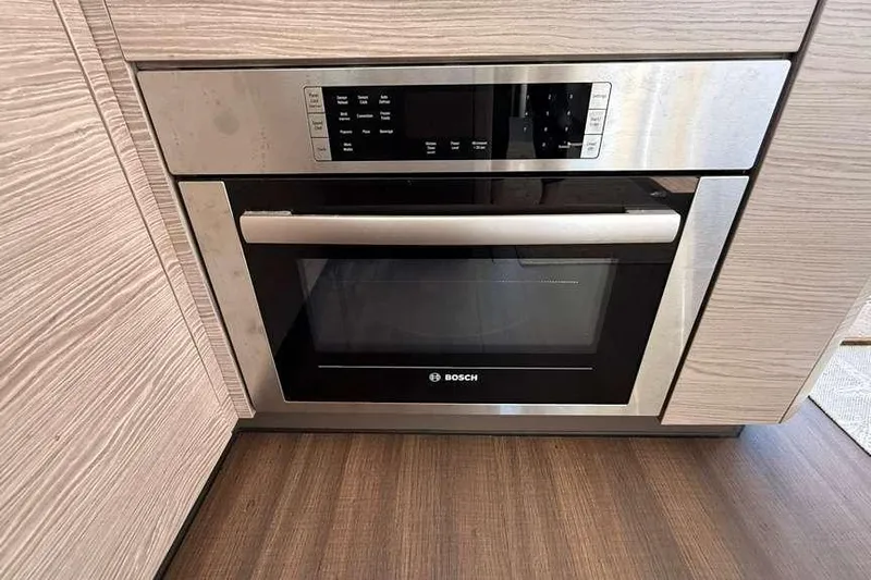 Electric Summer Yacht Photos Pics Built-in Bosch microwave in 2024 Greenline 48 Fly Hybrid yacht kitchen.