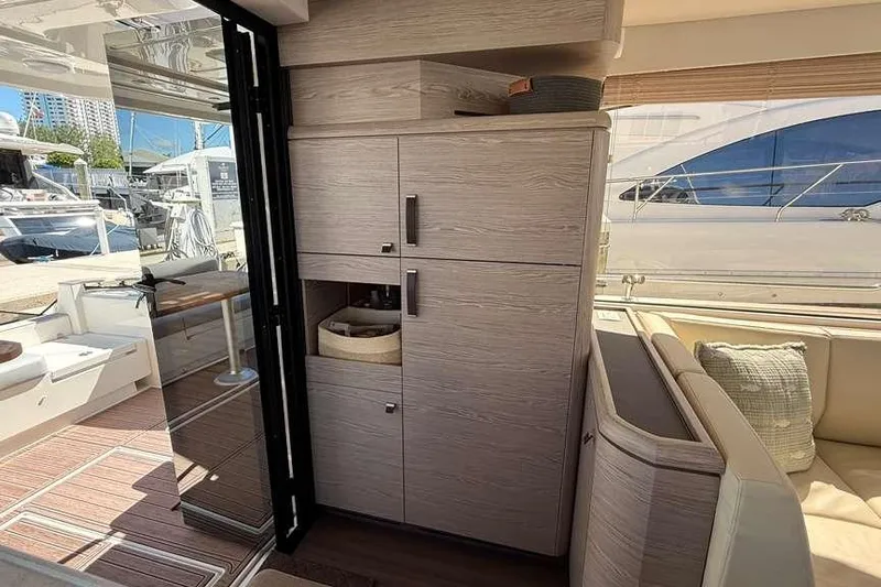 Electric Summer Yacht Photos Pics 2024 Greenline 48 Fly Hybrid yacht interior with modern cabinetry and outdoor view.