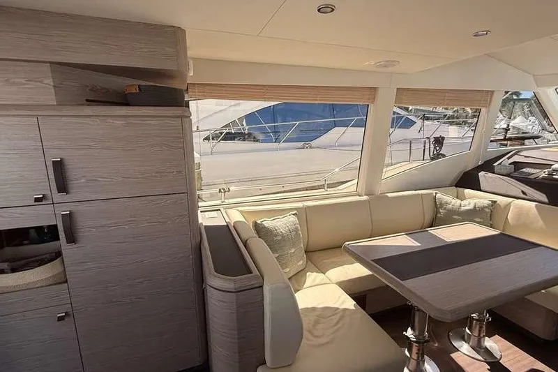 Electric Summer Yacht Photos Pics Interior of 2024 Greenline 48 Fly Hybrid yacht with modern seating and dining area.