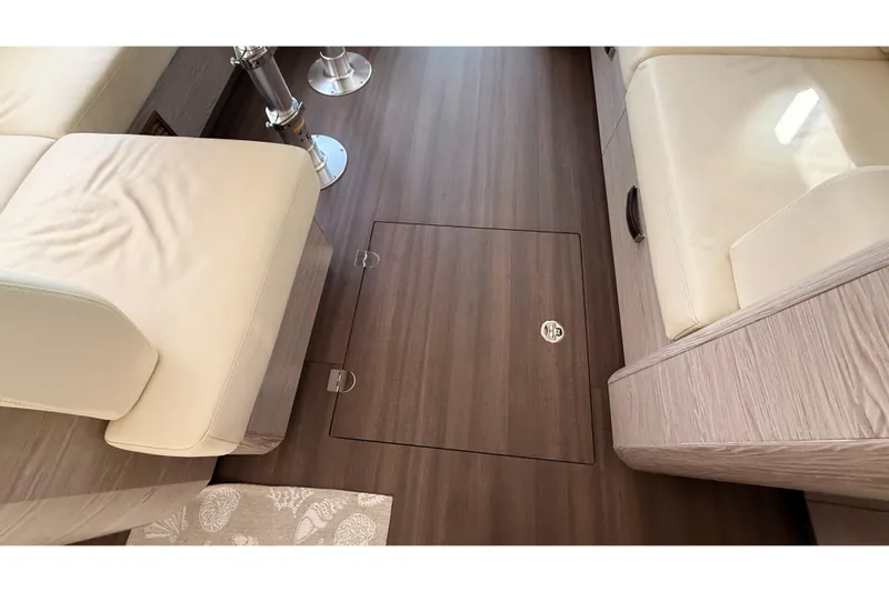 Electric Summer Yacht Photos Pics Interior of 2024 Greenline 48 Fly Hybrid yacht with wooden flooring and beige seating.