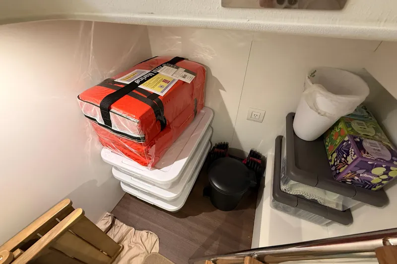 Electric Summer Yacht Photos Pics Storage area on a 2024 Greenline 48 Fly Hybrid yacht with life jackets and supplies.
