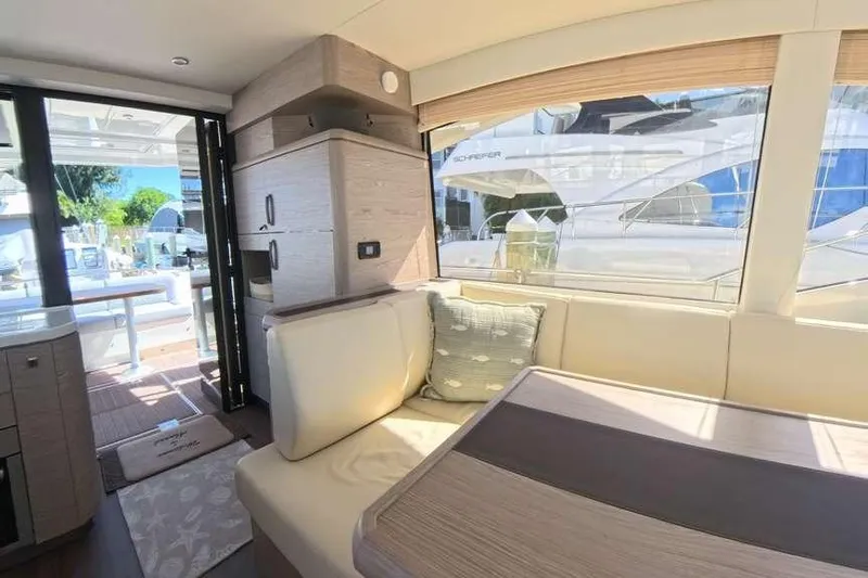 Electric Summer Yacht Photos Pics Interior of 2024 Greenline 48 Fly Hybrid yacht, featuring modern seating and large windows.