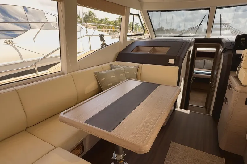 Electric Summer Yacht Photos Pics Interior of 2024 Greenline 48 Fly Hybrid yacht with elegant seating and dining area.