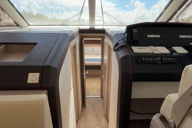 Electric Summer Yacht Photos Pics Interior view of 2024 Greenline 48 Fly Hybrid yacht, featuring modern navigation equipment and luxurious cabin.