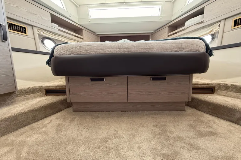 Electric Summer Yacht Photos Pics Luxurious interior of 2024 Greenline 48 Fly Hybrid yacht with elegant bedding and storage.