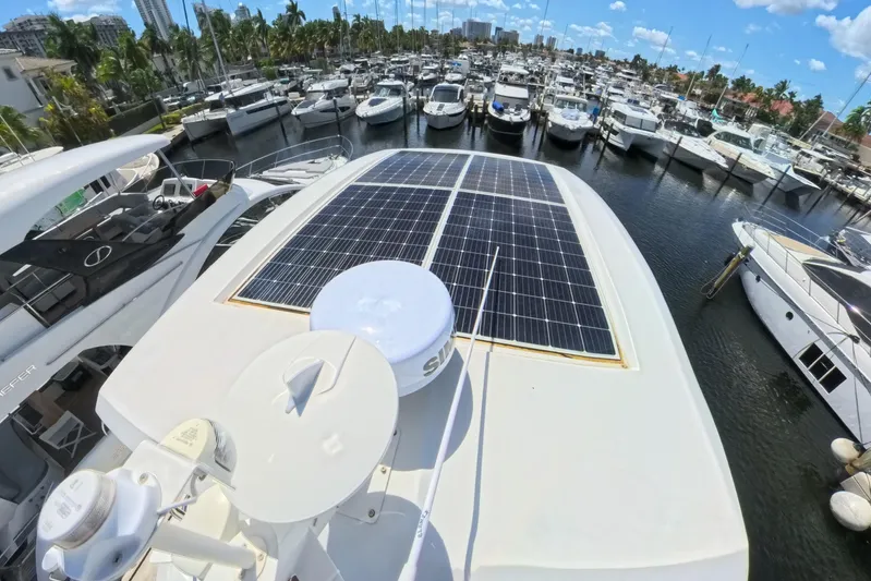 Electric Summer Yacht Photos Pics 2024 Greenline 48 Fly Hybrid yacht with solar panels docked in marina.