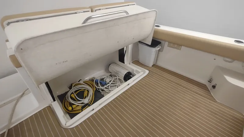  Yacht Photos Pics Storage compartment on 2000 Tiara Yachts 3500 Open, containing ropes and equipment.