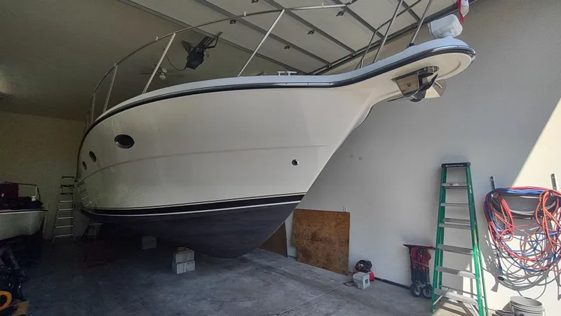  Yacht Photos Pics 2000 Tiara Yachts 3500 Open in garage, side view, with equipment nearby.