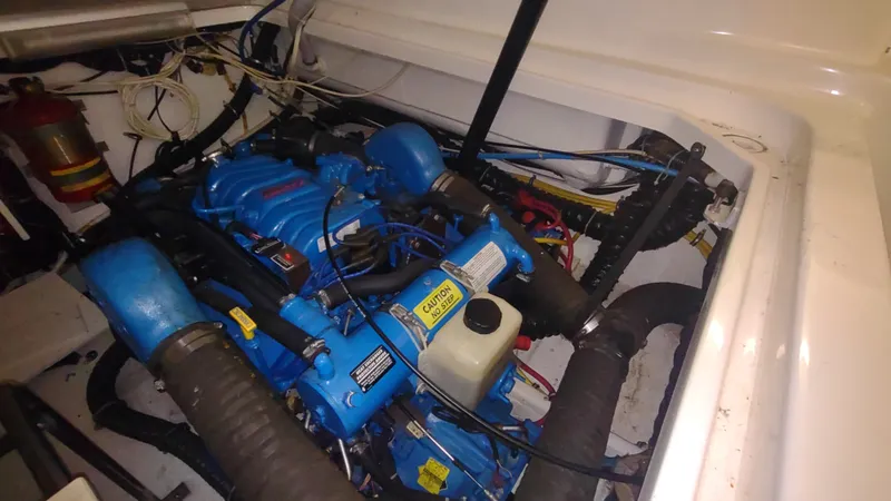  Yacht Photos Pics Engine compartment of a 2000 Tiara Yachts 3500 Open, featuring a blue marine engine.