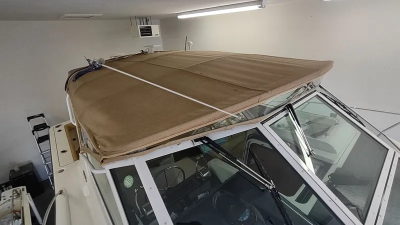  Yacht Photos Pics 2000 Tiara Yachts 3500 Open with covered cockpit in a garage setting.