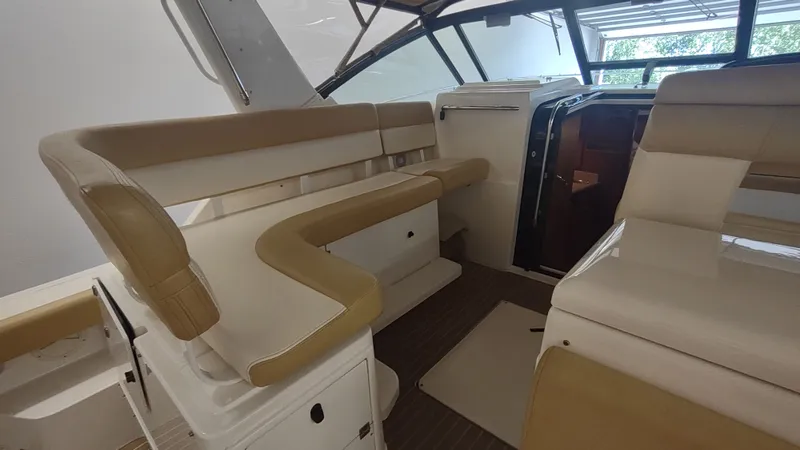  Yacht Photos Pics Interior of 2000 Tiara Yachts 3500 Open, featuring beige seating and sleek design.