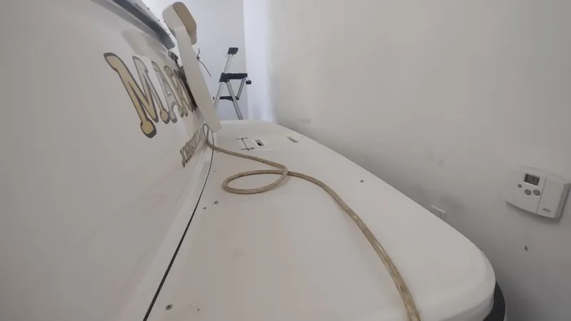  Yacht Photos Pics 2000 Tiara Yachts 3500 Open boat in storage with visible rope and equipment.