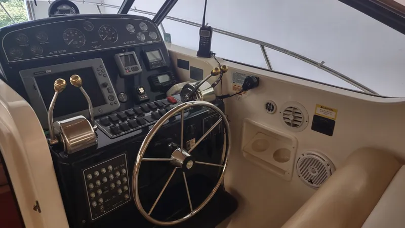  Yacht Photos Pics Helm of 2000 Tiara Yachts 3500 Open, featuring steering wheel and control panel.