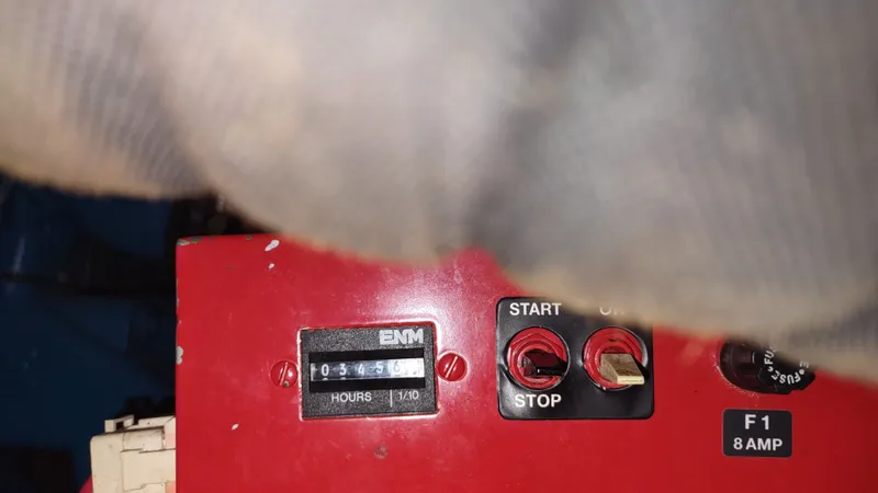  Yacht Photos Pics Control panel of a 2000 Tiara Yachts 3500 Open, featuring hour meter and start/stop switches.