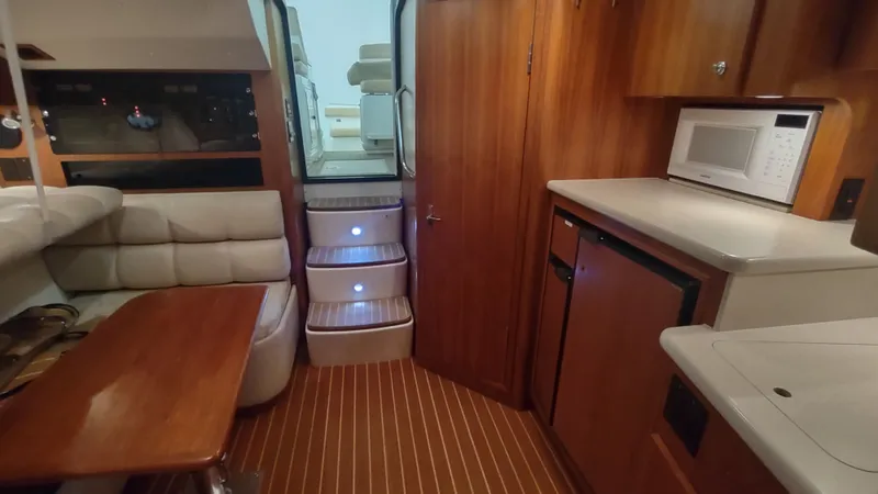  Yacht Photos Pics Interior of 2000 Tiara Yachts 3500 Open with kitchenette and seating area.