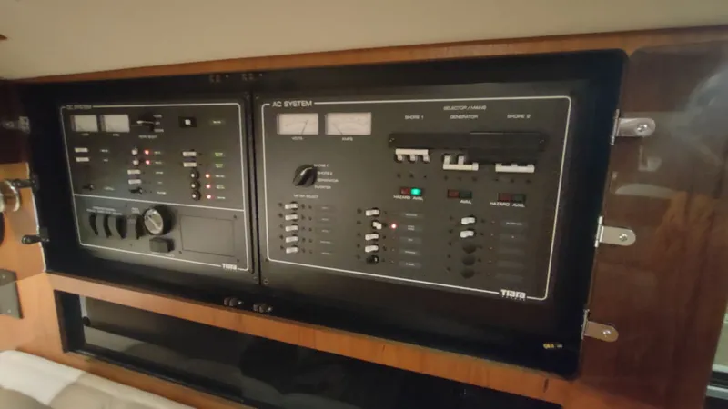  Yacht Photos Pics Control panel of a 2000 Tiara Yachts 3500 Open, featuring AC and DC systems.