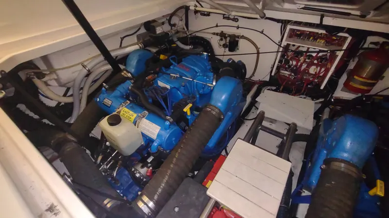  Yacht Photos Pics Engine room of a 2000 Tiara Yachts 3500 Open, featuring dual blue engines.