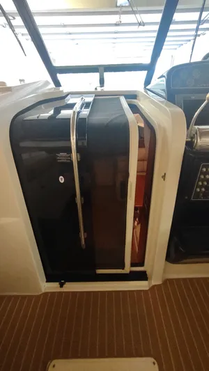  Yacht Photos Pics 2000 Tiara Yachts 3500 Open cabin entrance with sleek design and modern features.