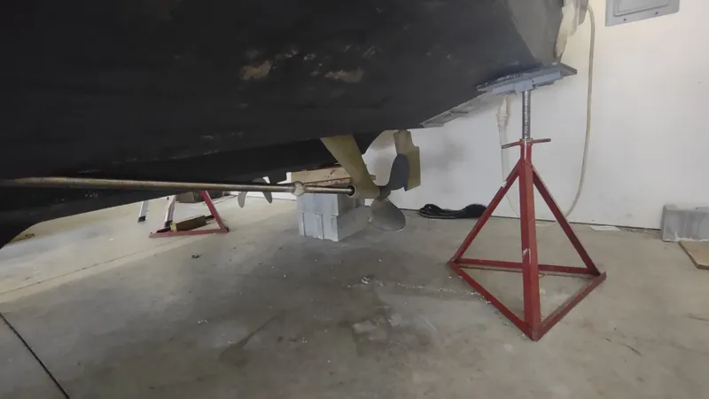  Yacht Photos Pics 2000 Tiara Yachts 3500 Open on stands, showing propeller and underbody in a garage.